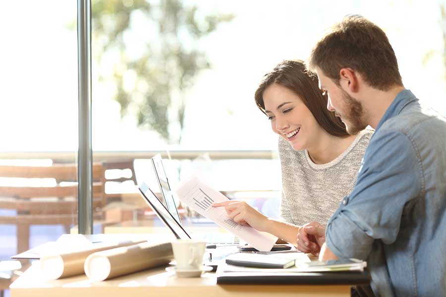 Two People looking at papers